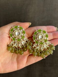 Small sized Kundan jhumkas with high quality stones available in 3 stunning colours! The perfect cute accessory for your next outfit! Luxury Green Hand-set Chandbalis, Affordable Festive Jhumkas With Latkans, Luxury Green Meenakari Jhumkas, Elegant Green Danglers For Festive Occasions, Bollywood Style Green Bridal Earrings For Party, Green Chandbali Danglers For Party, Green Latkan Earrings For Party, Green Earrings With Latkans For Party, Elegant Green Jhumkas For Festive Occasions