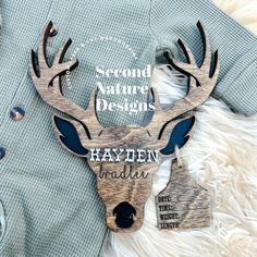 there is a deer head on top of a sweater that says, second nature designs hayden india