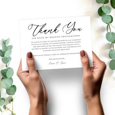 two hands holding up a thank you card