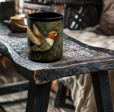 a coffee cup sitting on top of a wooden table next to a chair and couch