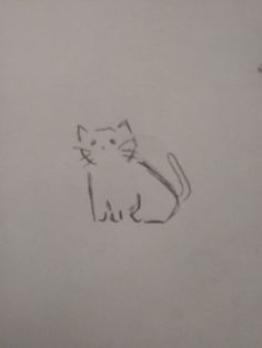 a drawing of a cat sitting on top of a piece of paper with writing underneath it