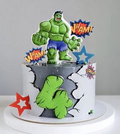 a birthday cake decorated with an image of the incredible hulk