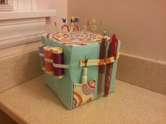 a sewing kit sitting on top of a counter