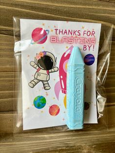 there is a blue plastic object with an astronaut on it and the words thanks for blasing by