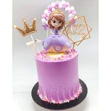 there is a purple cake with a princess on top