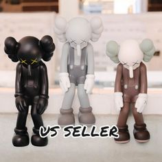 three small figurines are standing next to each other with the words us seller below them