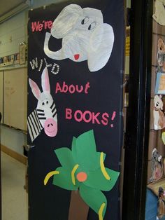 there is a sign that says we're all about books with animals on it