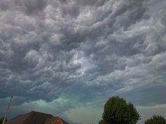 storm clouds loom over a suburban neighborhood