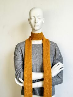 Enhance your style effortlessly with our Mustard Yellow Skinny Knit Scarf, a versatile accessory that exudes elegance and warmth. Handcrafted with care, this long scarf tie boasts a luxurious double-layered design, ensuring both coziness and chic sophistication. Wrap yourself in the rich hue of Yellow Ochre, adding a pop of vibrant color to any ensemble. Its slender silhouette offers endless styling possibilities, whether you choose to knot it loosely for a relaxed look or loop it snugly for add Long Scarf Tying, Women Scarves, Scarf Tie, Scarf Handmade, Yellow Ochre, Scarf Tying, Scarf Women, Long Scarf, Cozy Knits