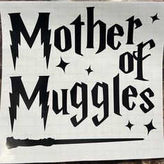 a sticker with the words mother of muggles written in black on white paper