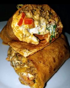 two burritos are stacked on top of each other