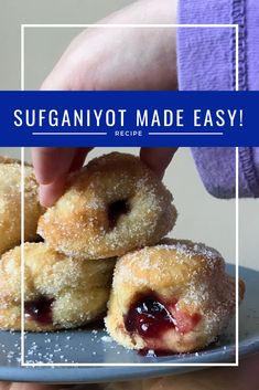 someone is picking up some sugary doughnuts on a plate with the words sufganyot made easy