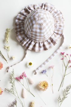 Keep your little ones stylish and protected with our Baby and Toddler Frill Sun Hat. Crafted from lightweight, breathable cotton, this charming hat features a brim with delicate frills for added cuteness. The adjustable chin strap ensures a secure fit, while the breathable fabric offers excellent sun protection. Perfect for sunny days at the beach, park, or any outdoor adventure, this hat is a must-have for every baby's wardrobe. Available in a variety of adorable colours in sizes 0-3 months up Beige Gingham, Toddler Sun Hat, Girls Sun Hat, Baby Sun Hat, Beach Park, Hat Baby, Baby And Toddler, Baby Bows, Bow Headband