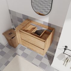 a bathroom with a sink, mirror and wooden box on the floor in front of it