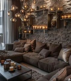 a living room filled with furniture and lots of lights hanging from the wall above it