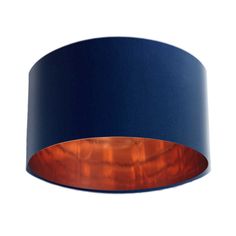 an orange and blue lamp shade hanging from the ceiling