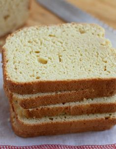 three slices of bread sitting on top of a red and white napkin