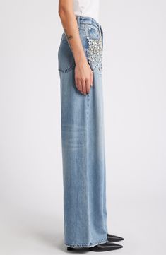 Hand-sewn jewels cascade from the front pockets on these high-waisted jeans crafted from lightweight denim in a wide-leg silhouette. 32" inseam; 25" leg opening; 12 1/4" front rise; 15" back rise (size 29) Zip fly with button closure Five-pocket style 61% cotton, 39% Tencel® lyocell Tencel lyocell is a more-sustainably produced fiber made with closed-loop processing Hand wash, line dry Imported High Waist Wide Leg Jeans, Rhinestone Jeans, Jean Crafts, Rag & Bone, Wide Leg Jeans, High Waist Jeans, Hand Sewn, Leg Jeans, Hand Sewing