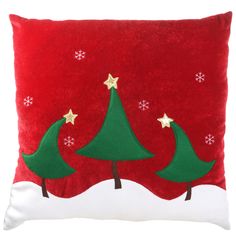 a red pillow with three green christmas trees on the front and white bottom, along with snowflakes