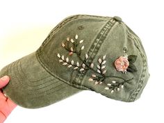 Hand embroidered green hat with floral design spread across side of hat. Adjustable strap to fit all sizes with ponytail opening in back. 6in. hat depth Hand wash to preserve quality. Christmas Gift For Women, Floral Hat, Green Hat, Embroidered Shoes, Embroidered Baseball, Green Hats, Women Pink, Hat For Women, Baseball Hat