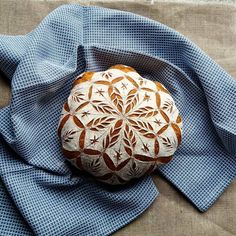 a piece of bread sitting on top of a blue cloth