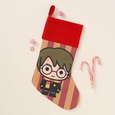 a harry potter christmas stocking next to candy canes