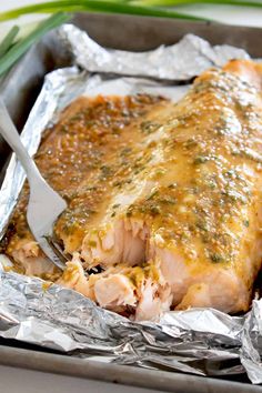 honey mustard glazed salmon in foil with a fork