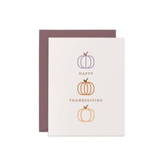 a card with three pumpkins and the words happy thanksgiving written in gold on it