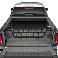 the back end of a pickup truck with its cargo cage open and it's tail lights on