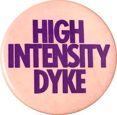 a button with the words high intensity dyke printed in purple on it's side