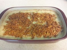 a casserole dish filled with food on top of a counter