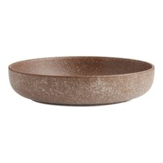 a brown bowl sitting on top of a white table