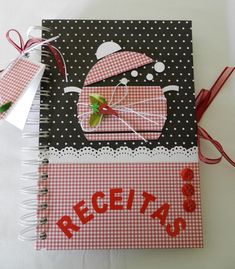 a red and white checkered notebook with a pink car on it's cover