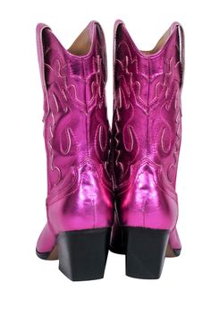 Shine on at your next rodeo with Dolce Vita's metallic pink short boots. Made with a leather upper and a western-style cut, these boots add a playful touch to any outfit. Pair with a leather skirt and a bodysuit for girls night out! Size 7.5 Leather upper Pull on Side pull tabs Blemish near inner left trim Heel height 2.5" Shaft 9.5" Circumference 13" Western Style Pink Mid-calf Boots, Western Style Pink Mid-calf Boots For Spring, Pink Fitted Western Mid-calf Boots, Western Style Fitted Pink Mid-calf Boots, Western Style Pink Mid-calf Boots For Winter, Pink Western Style Mid-calf Boots For Winter, Western Pink Heeled Boots For Spring, Pink Snip Toe Boots For Winter, Pink Western Boots For Rodeo