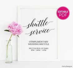 a pink carnation in a vase next to a white framed poster with the words shuttle service