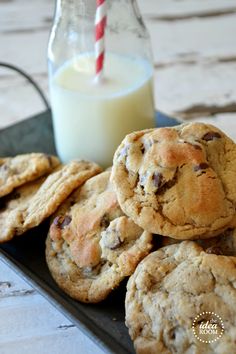 chocolate chip cookies and milk on a tray