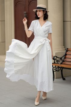 Make a statement in this stunning white linen wrap dress. Whether you're headed to a wedding, a garden party, or a casual brunch, this dress is sure to turn heads. DETAILS * 100% linen * Two Seam pockets * V-neck collar * No buttons, belted dress * A Line dress, Wrap dress * Above the ankle * Perfect for Summer, Spring * Wash by hand or machine with cold water, Ironing after dry *The model is 170 cm (5′7″) tall with a 80 cm (31.5") bust, 66 cm (26") waist. She is wearing the white dress in size Spring Wedding Wrap Dress With Short Sleeves, Summer Wedding Fitted Wrap Dress, Elegant Summer Wedding Wrap Dress, White Linen V-neck Maxi Dress, Linen V-neck Wedding Dress, White Linen V-neck Midi Dress, White Linen Maxi Dress For Wedding, Elegant Short Sleeve Linen Maxi Dress, White Linen V-neck Dress