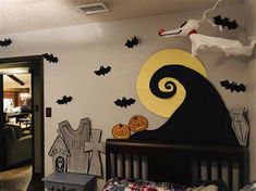 a bedroom decorated for halloween with decorations on the wall