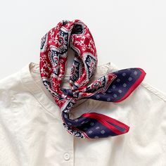 Add a touch of elegance to your outfit with this unisex silk bandana, featuring a striking geometric floral pattern in classic red and timeless velvet. Designed for both men and women, this versatile scarf is perfect for elevating any look—whether worn around the neck, tied in your hair, or adorn your bag. Crafted from premium silk, it offers a luxurious feel and sheen while remaining lightweight and breathable. The intricate hexagonal design blends classic bandana elements with modern flair, ma Silk Scarf Hair, Silk Bandana, Simple Ponytails, Kids Slippers, Bandana Scarf, Silk Hair, Bandana Print, Natural Silk, Silk Scarves