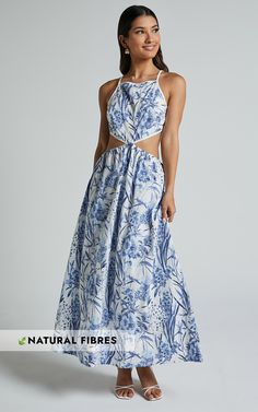 Stand out in the crowd with our Maenerva Midi Dress! This sleeveless straight-neck cut-out dress in a stunning blue floral print is perfect for any party day or night. Made from a comfortable blend of rayon and cotton, this fit & flare dress not only looks amazing but feels incredible too. The midi length adds a touch of sophistication while the cut-out detail adds just the right amount of edge. Get ready to turn heads and embrace your inner fashionista with this empowering and inclusive pie Summer Cutout Dress For Brunch, Elegant Sundress For Summer Parties And Spring, Sleeveless Floral Midi Dress For Summer Parties, Blue Sleeveless Floral Dress For Party, Sleeveless Blue Floral Dress For Party, Beach Maxi Dress With Tie Back And Straight Neckline, Sleeveless Beachwear Dress For Garden Party, Breezy Spring Dress For Parties, Halter Neck Cutout Dress For Brunch