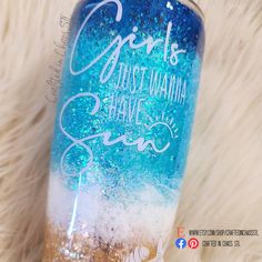 a blue and white glittered tumbler with the words girls just wanna some sea on it