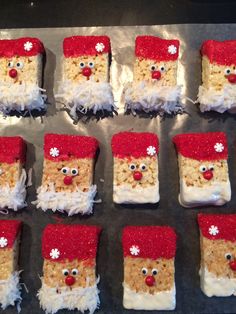 some kind of santa clause made out of rice krispy kreme treats on a baking sheet