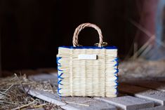 Alice is the name of one of the best basket artisans, responsible for passing knowledge on to younger family generations. Naturally hand-made with Alice's techniques since 1959. The Straw Portuguese basket (reed) is made with distinct patterns which makes them special and unique; no two baskets are identical in size, shape or color. Measures (approximately):  Length: 17 cm ( 6.7 in ) Width: 14 cm ( 5.5 in ) Height: 10 cm ( 3.9 in )  Note: These beautiful baskets are made of 100% ECO-FRIENDLY AND HYPOALLERGENIC reed;  100% Made of Organic Reed. Made in Portugal, Europe. Discover the traditional process behind these ancient techniques -> www.lloreta.com Eco-friendly Woven Straw Bag With Top Handle, Artisan Basket-shaped Straw Bags, Eco-friendly Rattan Bags With Braided Handles, Eco-friendly Multicolor Straw Bag With Braided Handles, Eco-friendly Straw Basket Bag With Braided Handles, Colorful Bags, Basket Bag, Grocery Bag, Decorative Wicker Basket