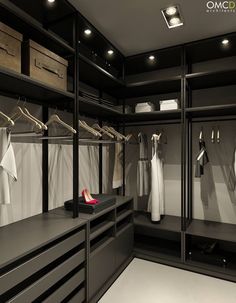 a walk in closet filled with lots of clothes