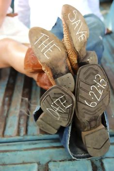 two pairs of shoes with writing on them sitting in the back of a pickup truck