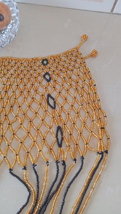 African Beaded wedding necklace, Zulu Cape necklace, Beaded shawl necklace, Christmas gift for her, Women jewelry, Bridesmaid gift This beaded bib necklace is superbly crafted which can be worn with any outfit at different occasions and it will absolutely makes you stand out. Main color - gold. The necklace can be available in different colors. Wholesale available at a fair price,please contact me. For any clarification,please send me a convo or an e-mail. Thank you for visiting and happy shoppi Traditional Gold Beaded Bib Necklace, Gold Bib Necklace With Large Beads For Jewelry Making, Gold Beaded Choker For Celebration, Elegant Handmade Beads For Festive Occasions, Gold Beaded Chain Bib Necklace As Gift, Gold Choker With Large Beads For Gift, Handmade Gold Beads For Wedding, Gold Choker With Large Beads As Gift, Handmade Gold Wedding Beads