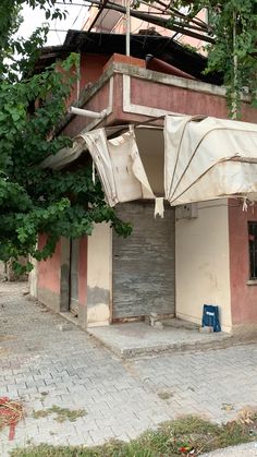 an old building with awnings on the outside