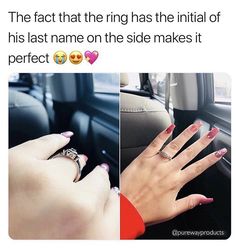 two hands with rings on their fingers in the car