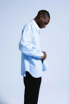 An ultra-crisp button up shirt with the effortless proportions of 90's Wall Street. Worn untucked or half-tucked, this oversized, billowy office staple makes for the ultimate off-duty move. Constructed from 100% pima cotton, a superior high-grade cotton known for it's incredible softness. Oversized Business Tops With Button Cuffs, Oversized Classic Tops For Business Casual, Modern Oversized Shirt For Office, Oversized Button-up Business Top, Oversized Button-up Tops For Business, Oversized Business Tops With Button Closure, Modern Oversized Button-up Tops, Oversized Button-up Shirt For Daywear, Oversized Classic Shirt With Fold Down Collar