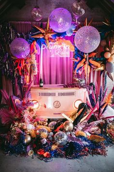 an assortment of balloons and decorations on display